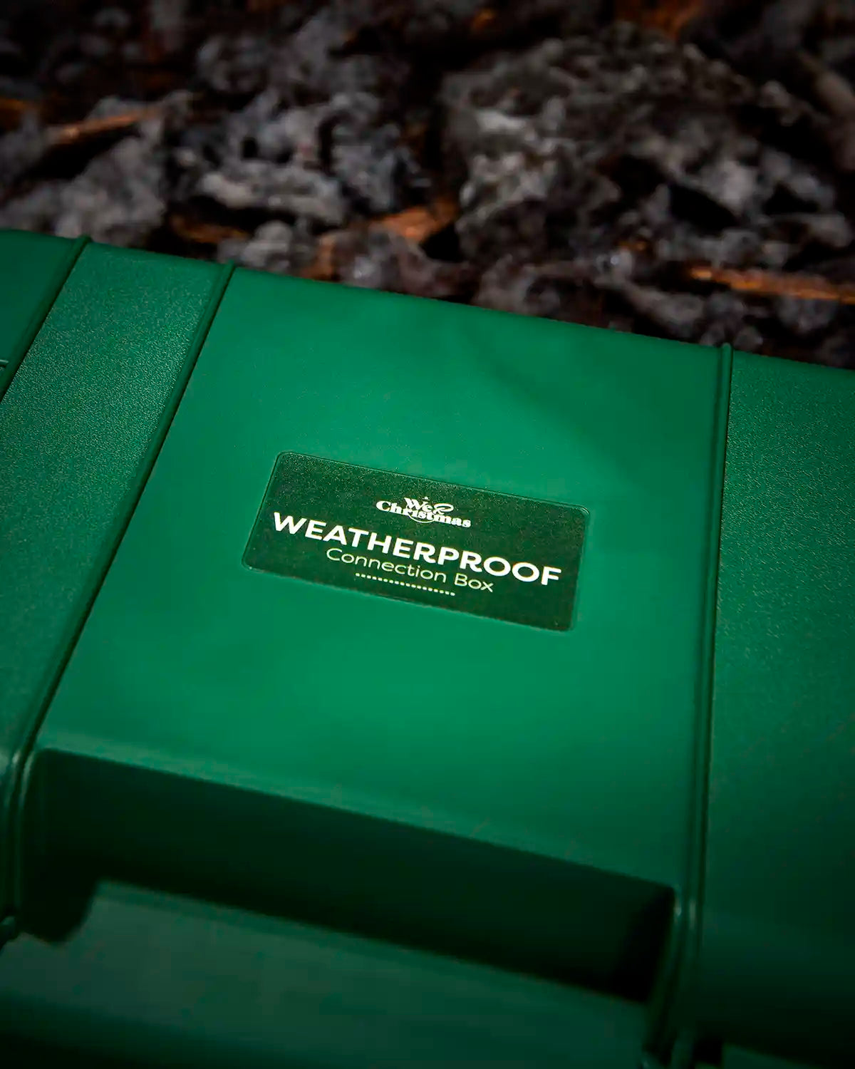 Close-up of the weatherproof connection box label on the green case.