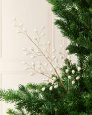 68 cm white pearl beaded Christmas tree pick arranged among green Christmas tree branches.