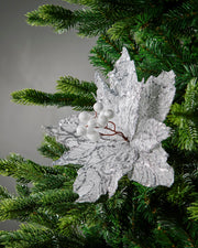 Close-up of white berries and silver sequin detail on poinsettia flower
