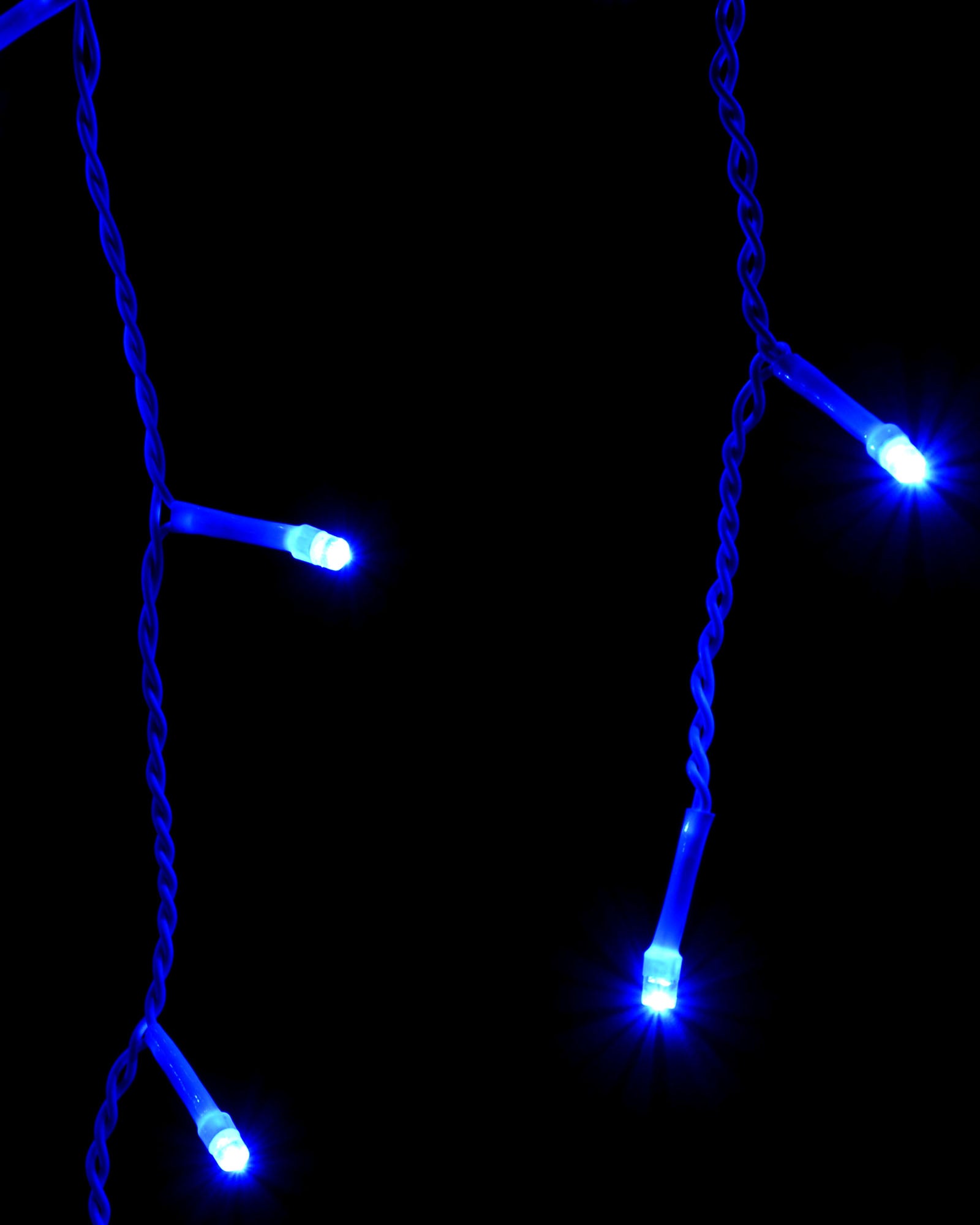 Close-up of blue LED icicle lights on hanging wire strands
