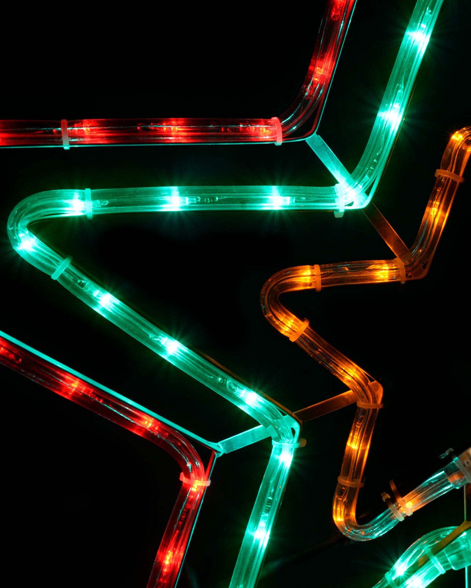 Close-up of the red, green and amber rope light sections on the animated flashing star