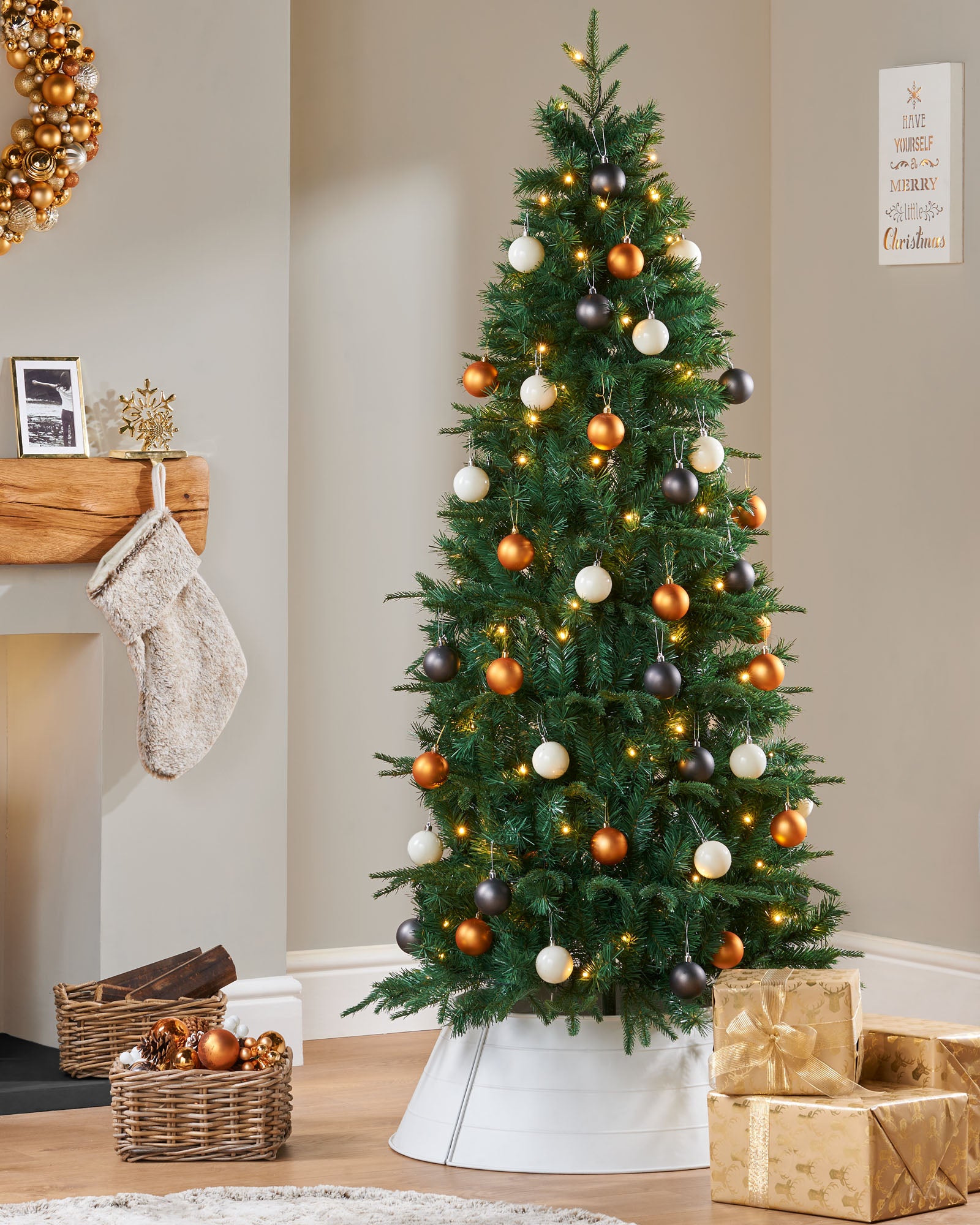 Pre-lit pop-up Christmas tree with 490 mixed PE and PVC tips, 100 warm white LED lights, 60 white, silver, and gold baubles, built-in memory controller with 8 lighting functions, and foldable metal stand—pre-decorated for easy assembly and timeless festive elegance in a decorated indoor setting.