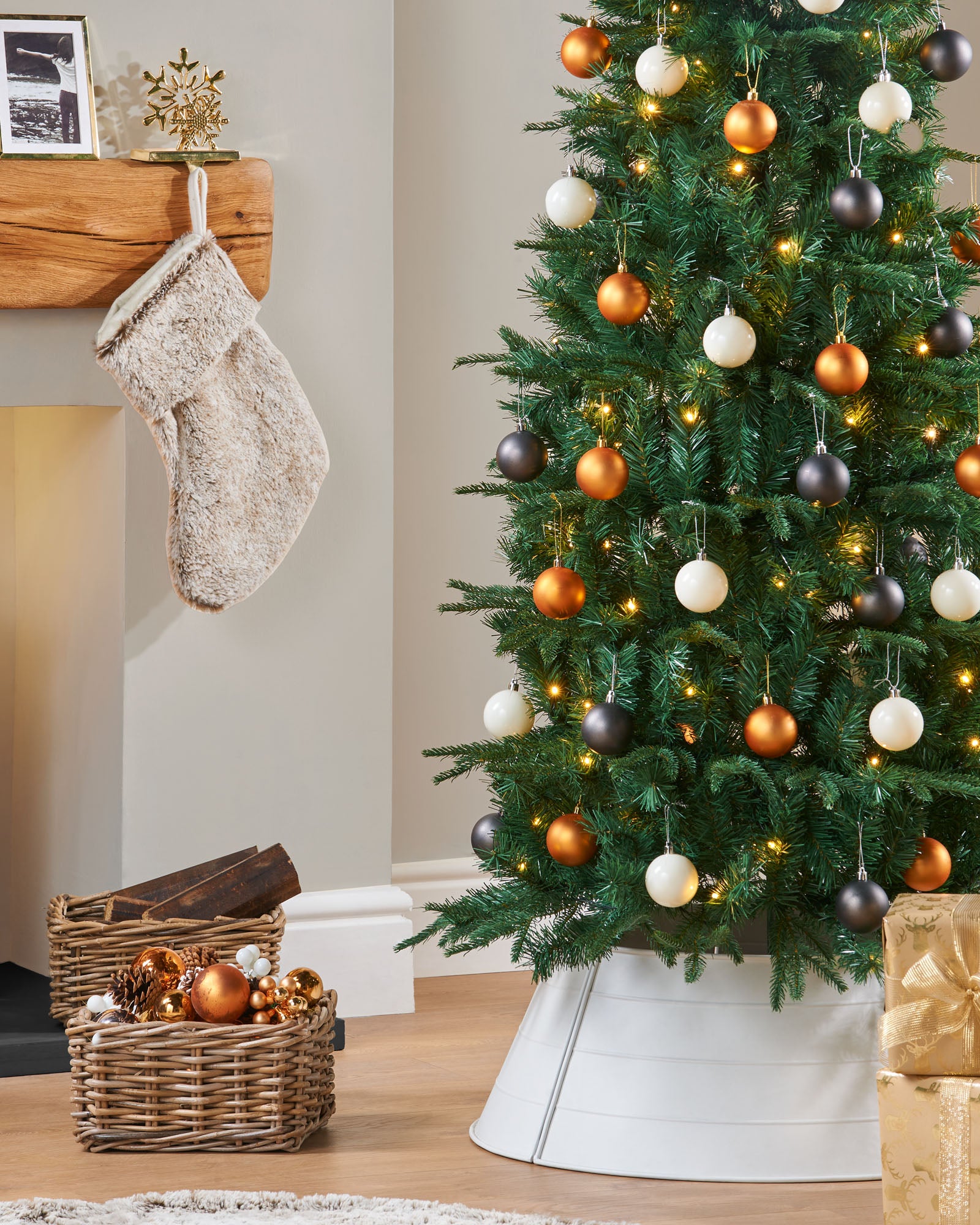 Pre-lit pop-up Christmas tree with 490 mixed PE and PVC tips, 100 warm white LED lights, 60 white, silver, and gold baubles, built-in memory controller with 8 lighting functions, and foldable metal stand—pre-decorated for easy assembly and timeless festive elegance in a decorated indoor setting.