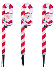 Three red and white light up Santa Claus Candy cane garden spikes on a white background